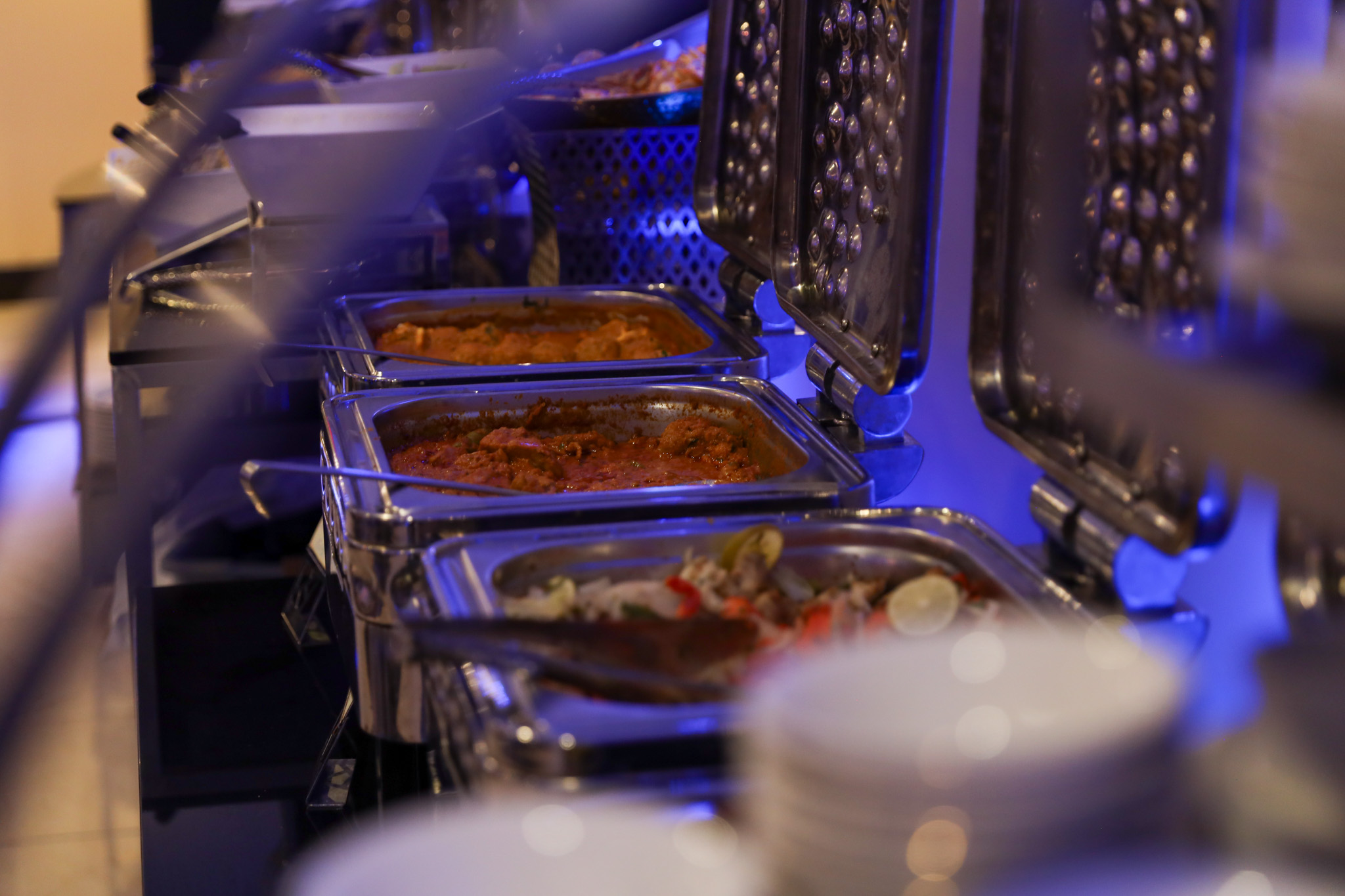 Catered buffet arranged for an indoor graduation celebration