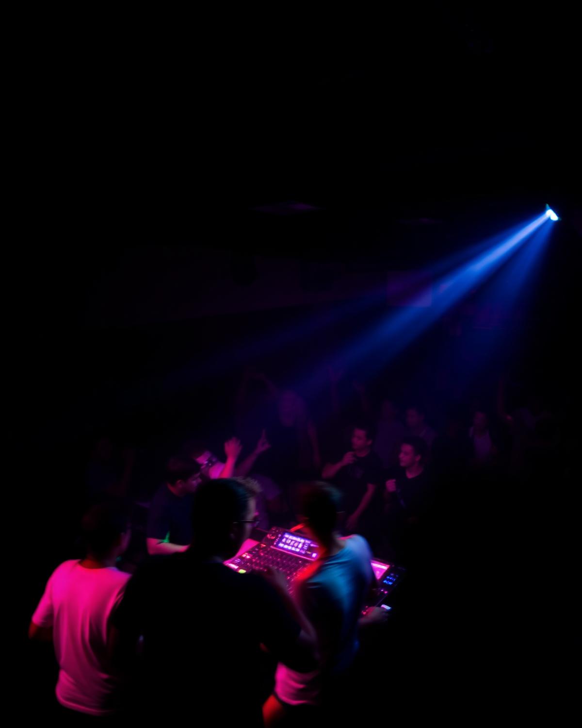 DJ booth under a lone spotlight